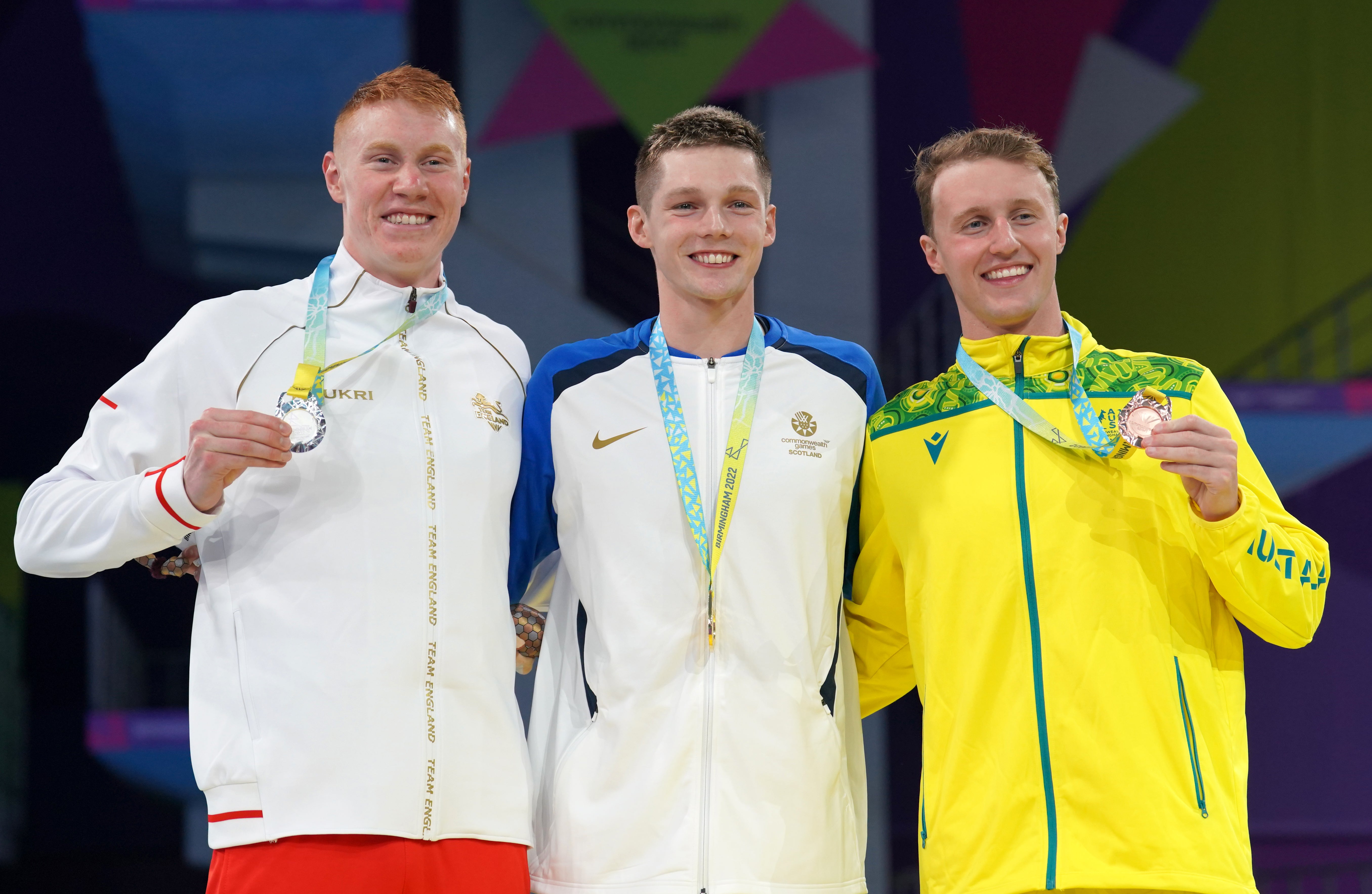 Duncan Scott, centre, claimed gold in the men’s 200m freestyle with victory over Tom Dean, left (David Davies/PA)