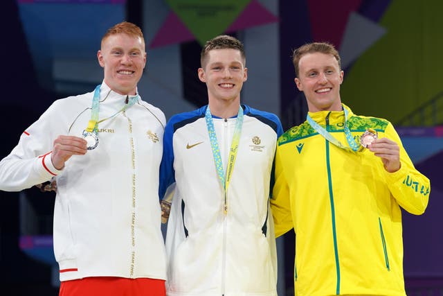 Duncan Scott, centre, claimed gold in the men’s 200m freestyle with victory over Tom Dean, left (David Davies/PA)