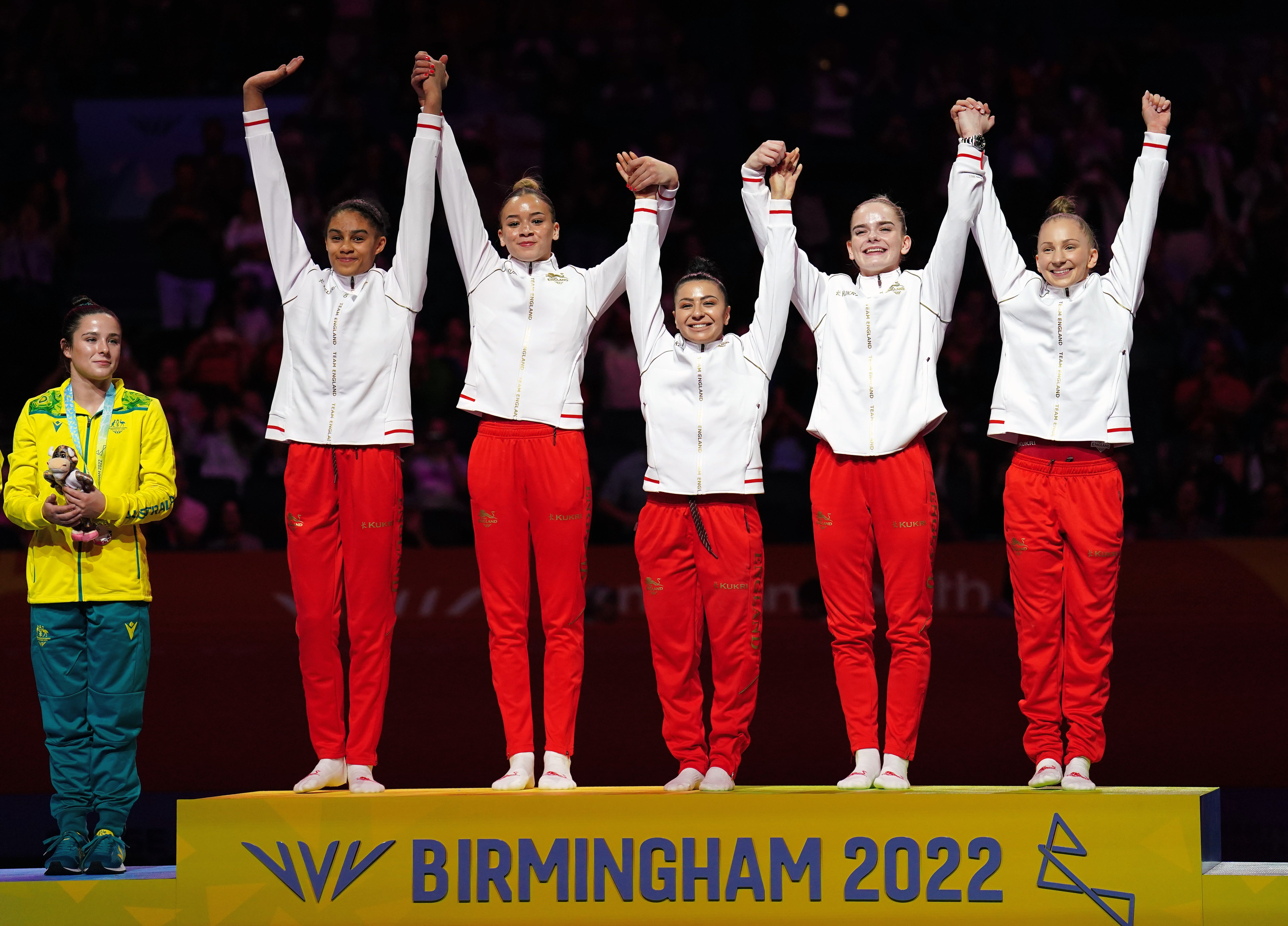 England’s Ondine Achampong, Georgia-Mae Fenton, Claudia Fragapane, Alice Kinsella and Kelly Simm (left-right) celebrate winning gold (Mike Egerton/PA)