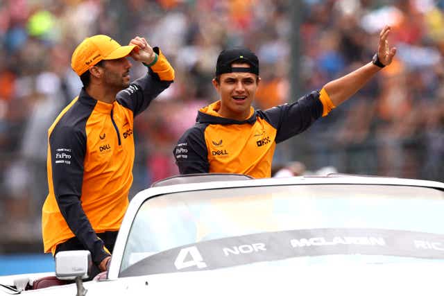 <p>Ricciardo and Norris wave to fans in Hungary </p>