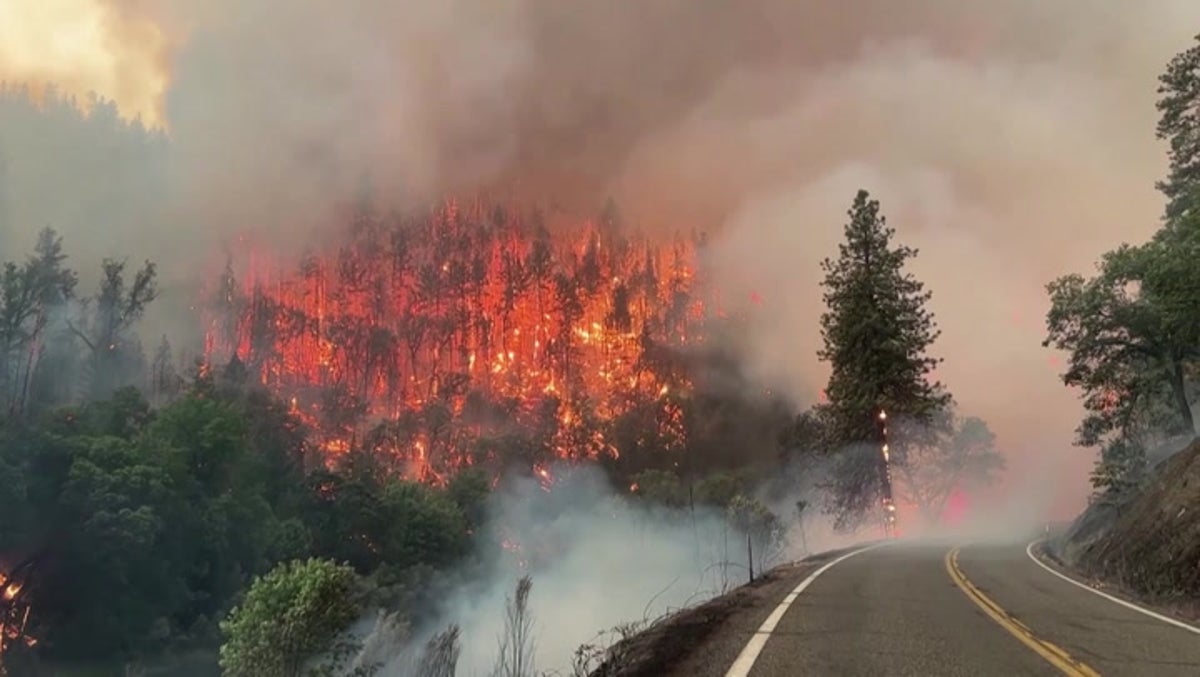 California wildfire burns 30,000 acres of national forest as nearby town is evacuated