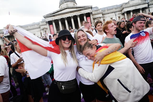 Fans celebrate the final whistle in Trafalgar Square, London, after watching the screening of the UEFA Women’s Euro 2022 final held at Wembley Stadium (Aaron Chown/PA)