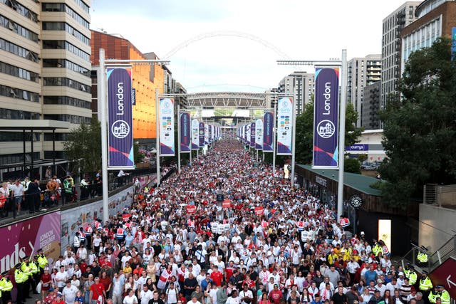 <p>England fans make their way from the stadium after the final</p>