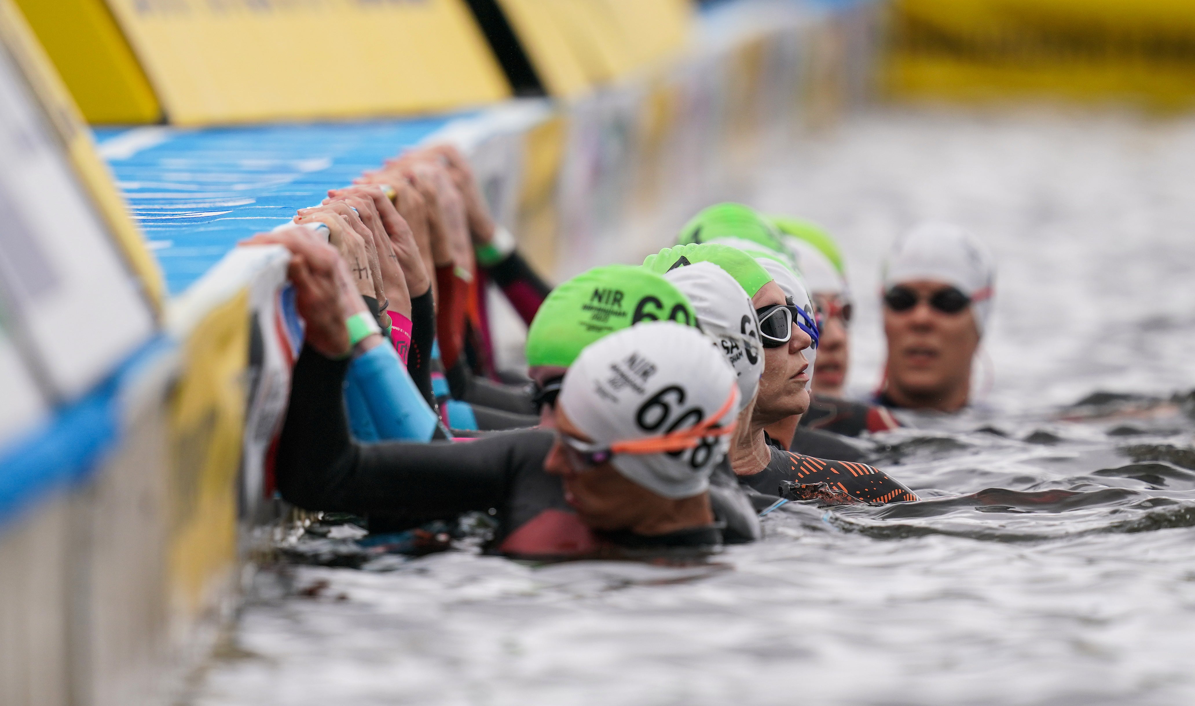 Athletes prepare for the start of the swim in the Women’s Para Triathlon on day three of the 2022 Commonwealth Games in Birmingham (David Davies/PA)