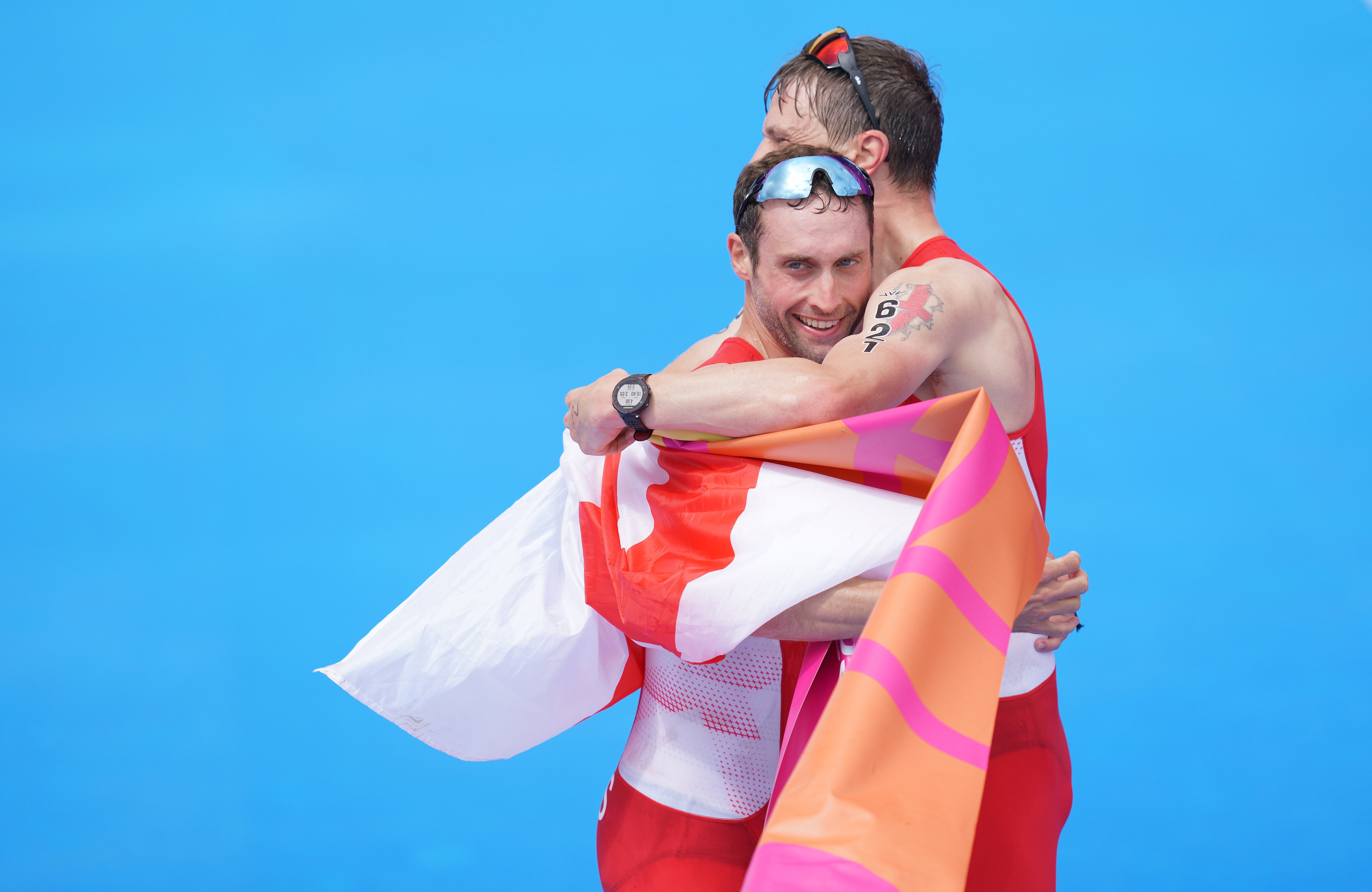 England’s David Ellis, left, and guide Luke Pollard celebrate winning gold in the Men’s Para Triathlon at the 2022 Commonwealth Games in Birmingham (David Davies/PA)