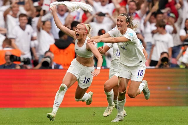 <p>England’s Chloe Kelly (left) celebrates with Jill Scott after scoring the winning goal in the Euro 2022 final (Jonathan Brady/PA)</p>