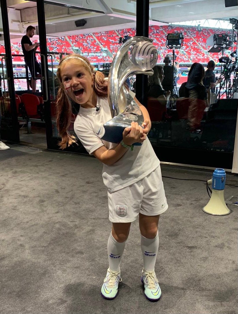 England fan Tess lifts the Euro 2022 trophy