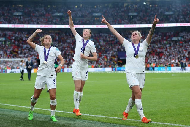 England trio Rachel Daly, Ellen White and Millie Bright sing out in the post-match celebrations (Nigel French/PA)