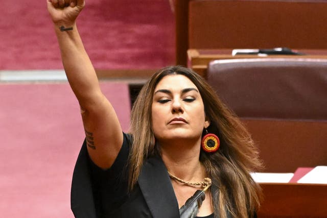 <p>Lidia Thorpe, Australian Greens senator for Victoria, raises her arm during her swearing-in ceremony in the senate chamber at Parliament House in Canberra</p>