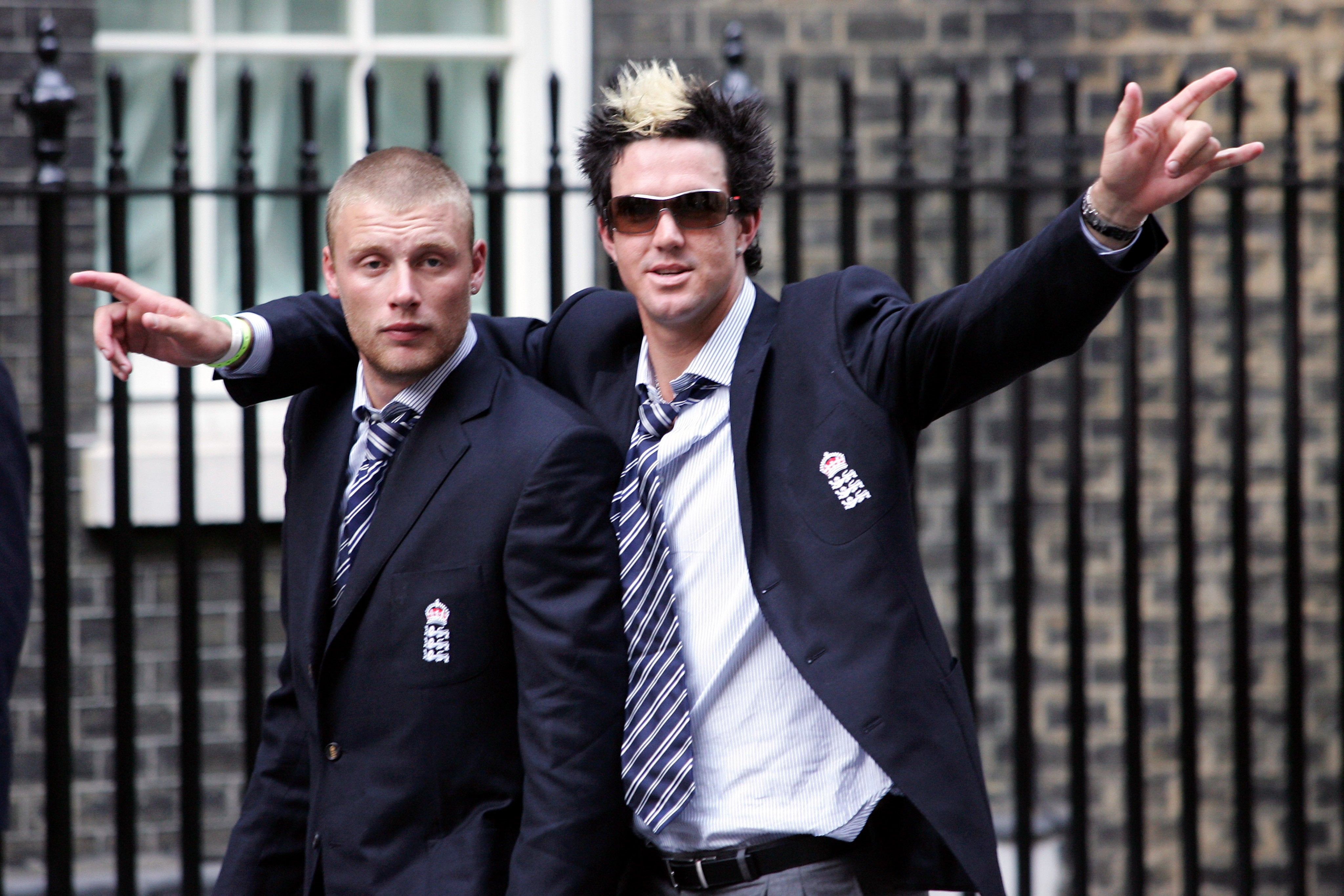 England cricketers Andrew Flintoff, left, and Kevin Pietersen arrive at Downing Street following the Ashes victory parade in London in 2005 (Mark Lees/PA)