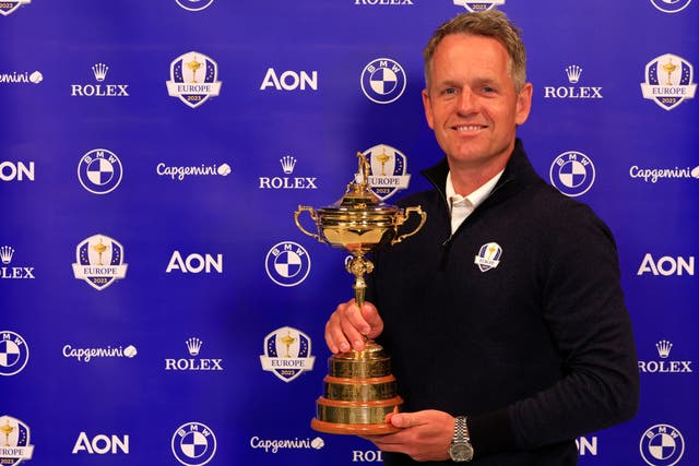 <p>Luke Donald poses with the Ryder Cup after being announced as Europe’s new captain</p>