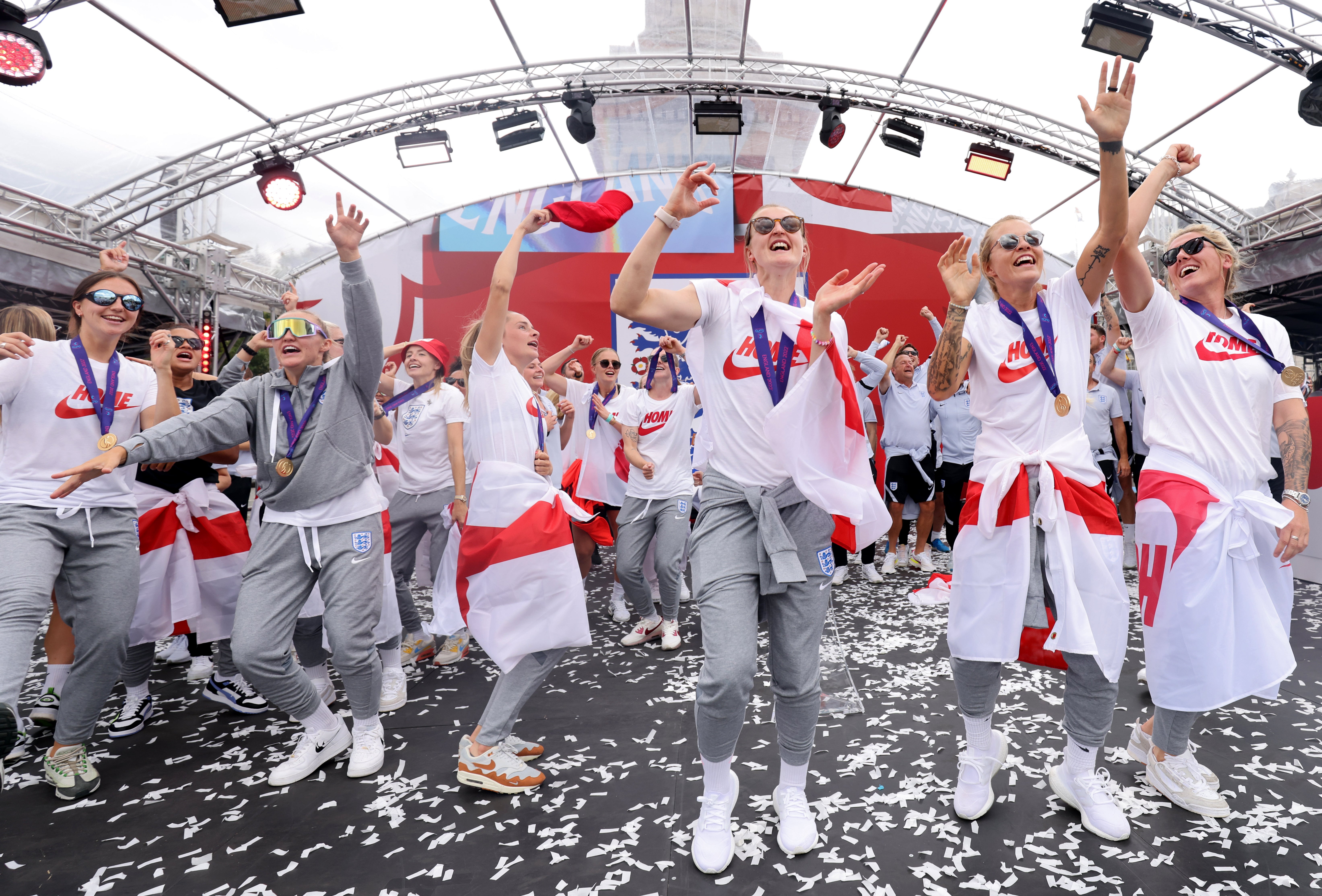 England players sing Sweet Caroline on stage during a fan celebration to commemorate England’s historic Uefa Women’s Euro 2022 triumph in Trafalgar Square, London (James Manning/PA)