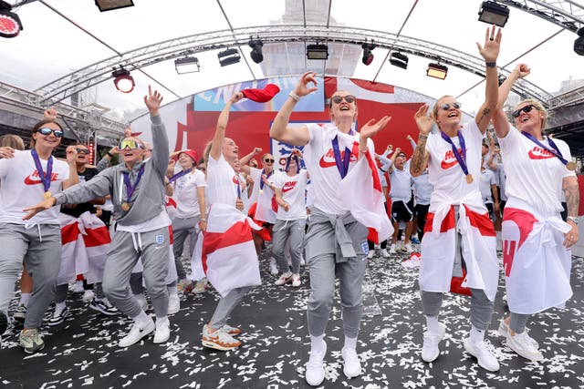 England players sing Sweet Caroline on stage during a fan celebration to commemorate England’s historic Uefa Women’s Euro 2022 triumph in Trafalgar Square, London (James Manning/PA)