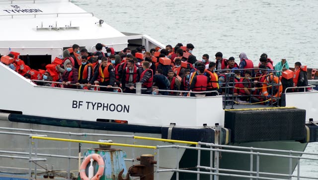 A group of people thought to be migrants are brought in to Ramsgate, Kent, onboard a Border Force vessel following a small boat incident in the Channel. Picture date: Monday August 1, 2022. (Gareth Fuller/PA)