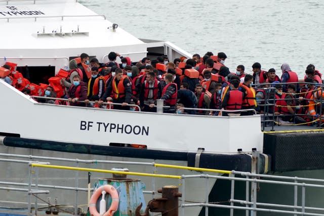 A group of people thought to be migrants are brought in to Ramsgate, Kent, onboard a Border Force vessel following a small boat incident in the Channel. Picture date: Monday August 1, 2022. (Gareth Fuller/PA)