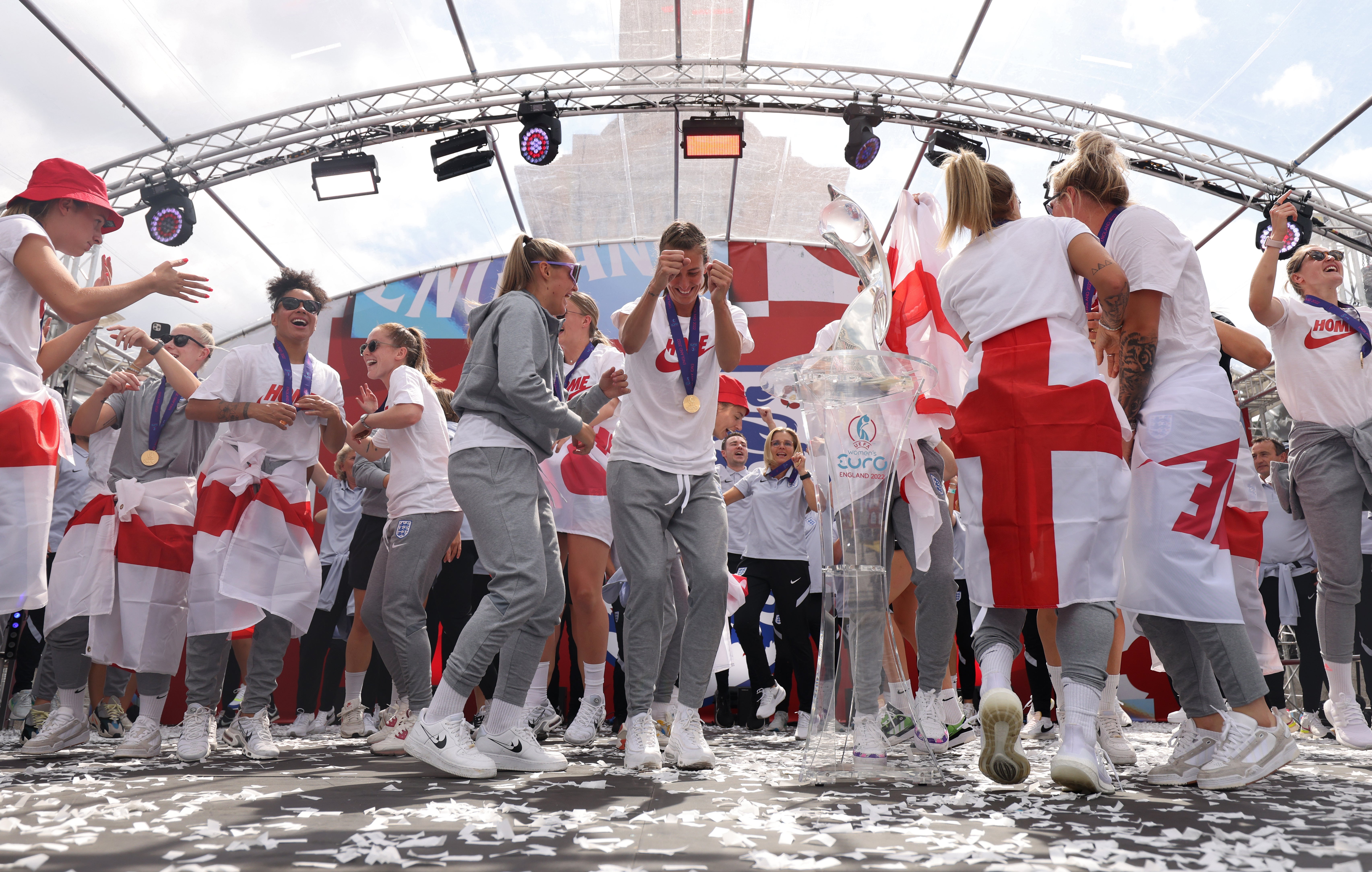 England players sing Sweet Caroline on stage during a fan celebration in Trafalgar Square, London, to commemorate England’s historic Euro 2022 triumph (James Manning/PA)