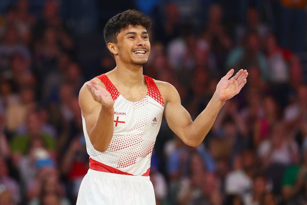 Jake Jarman reacts to his gold medal-winning marks from judges in Birmingham