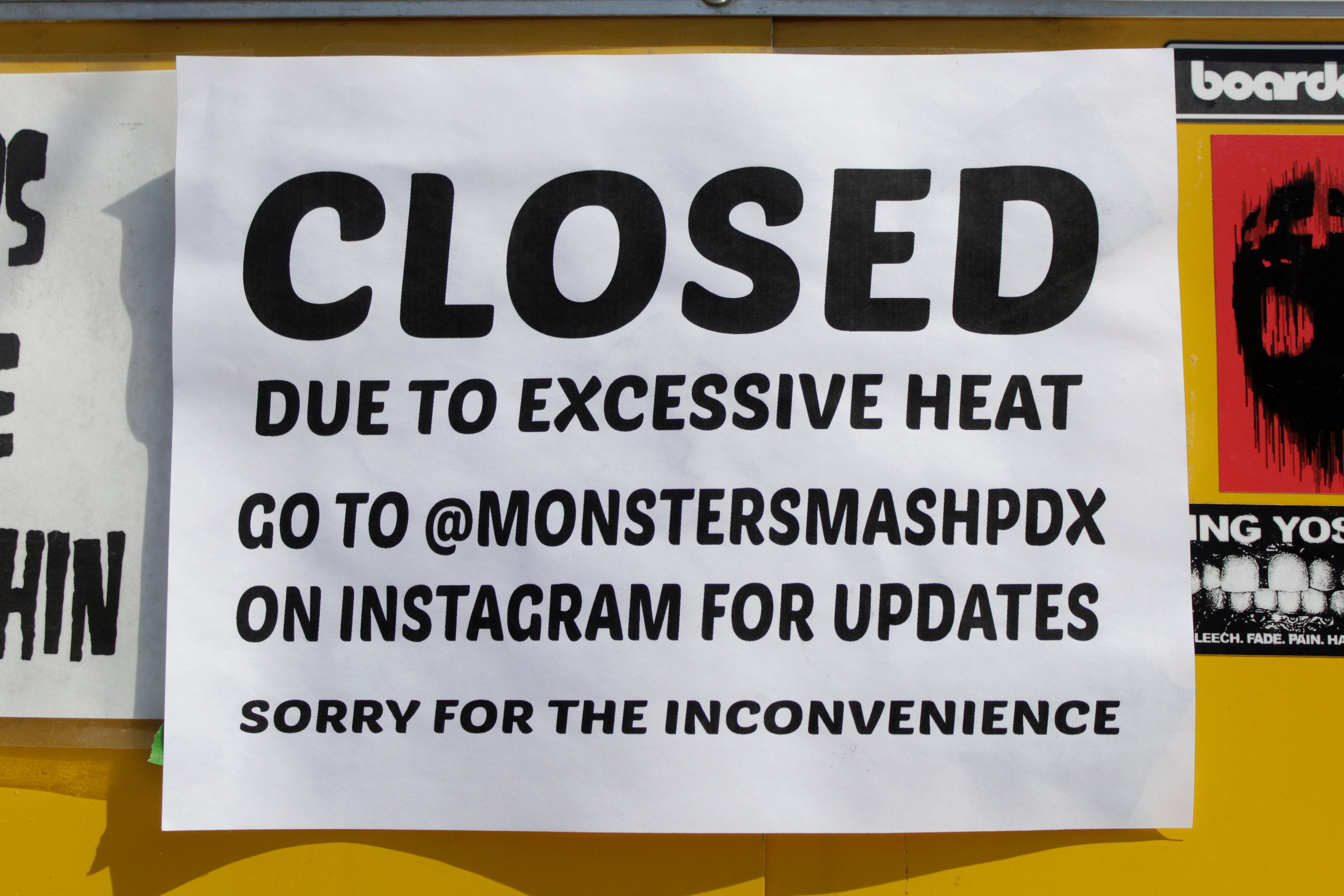 A closed sign is posted outside Rico Loverde's Monster Smash Burgers food cart in Portland, Ore., on Wednesday, July 27