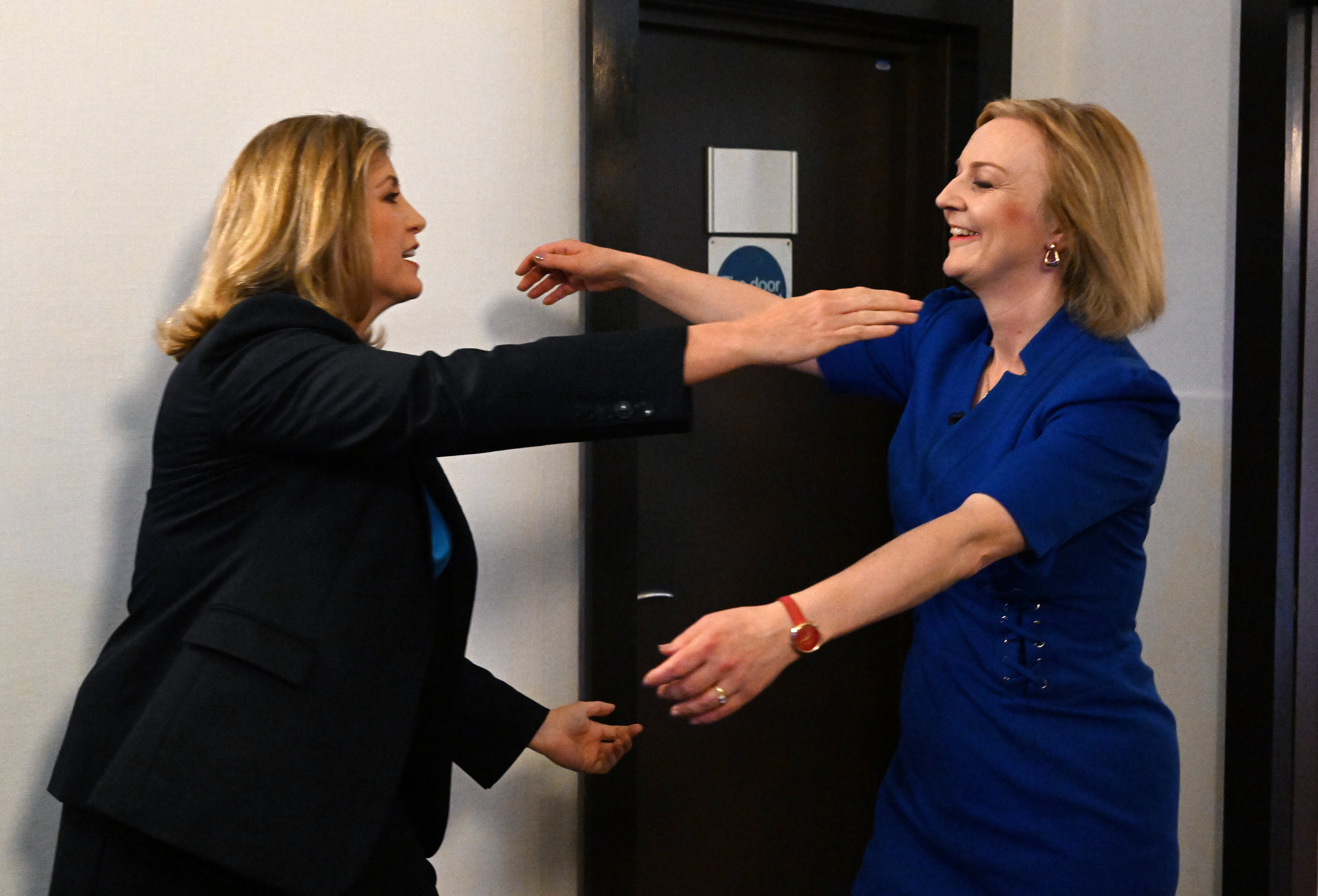 Mordaunt, left, greets Truss in Exeter