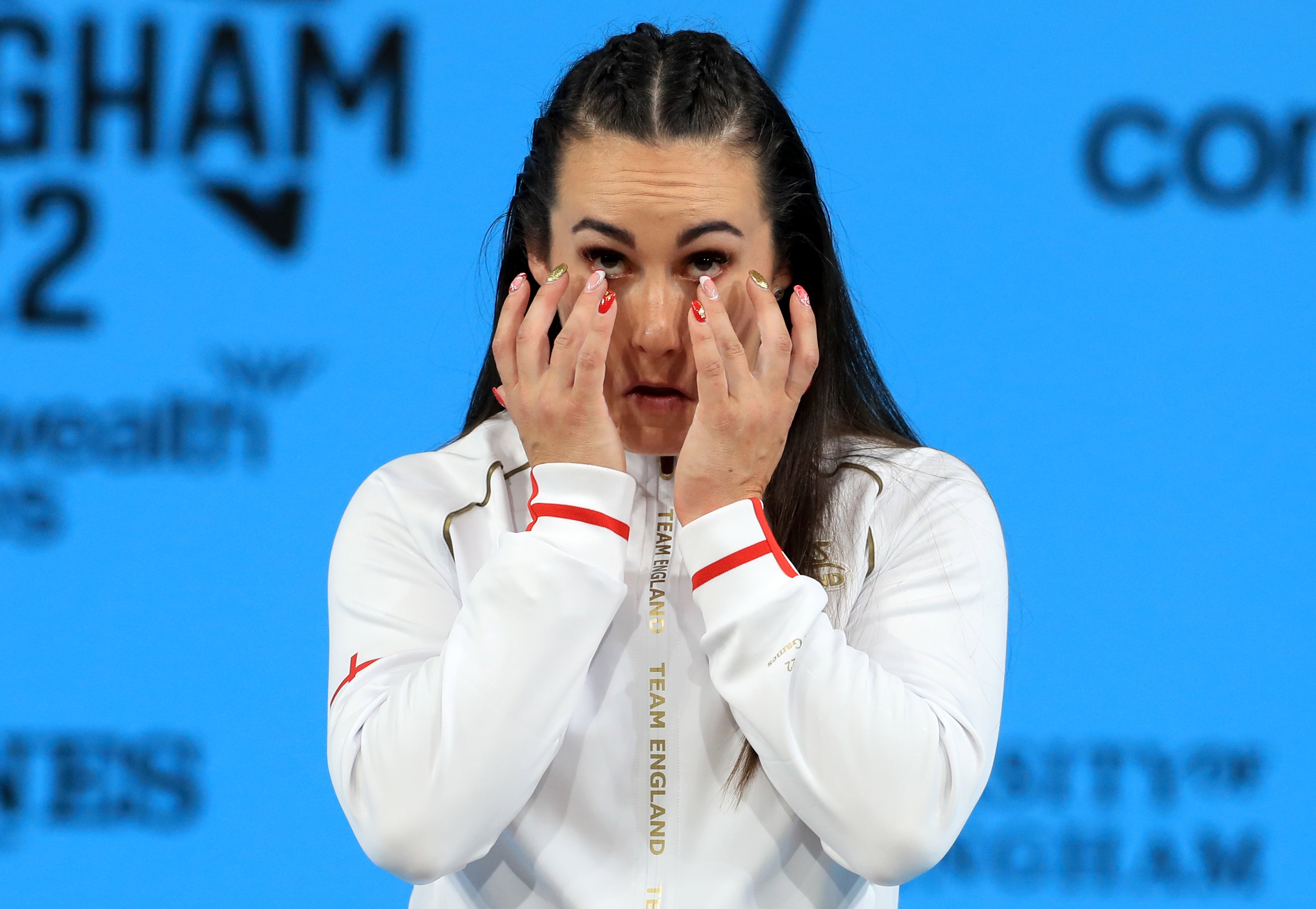 Sarah Davies gets emotional after winning weightlifting gold in Birmingham (Bradley Collyer/PA)