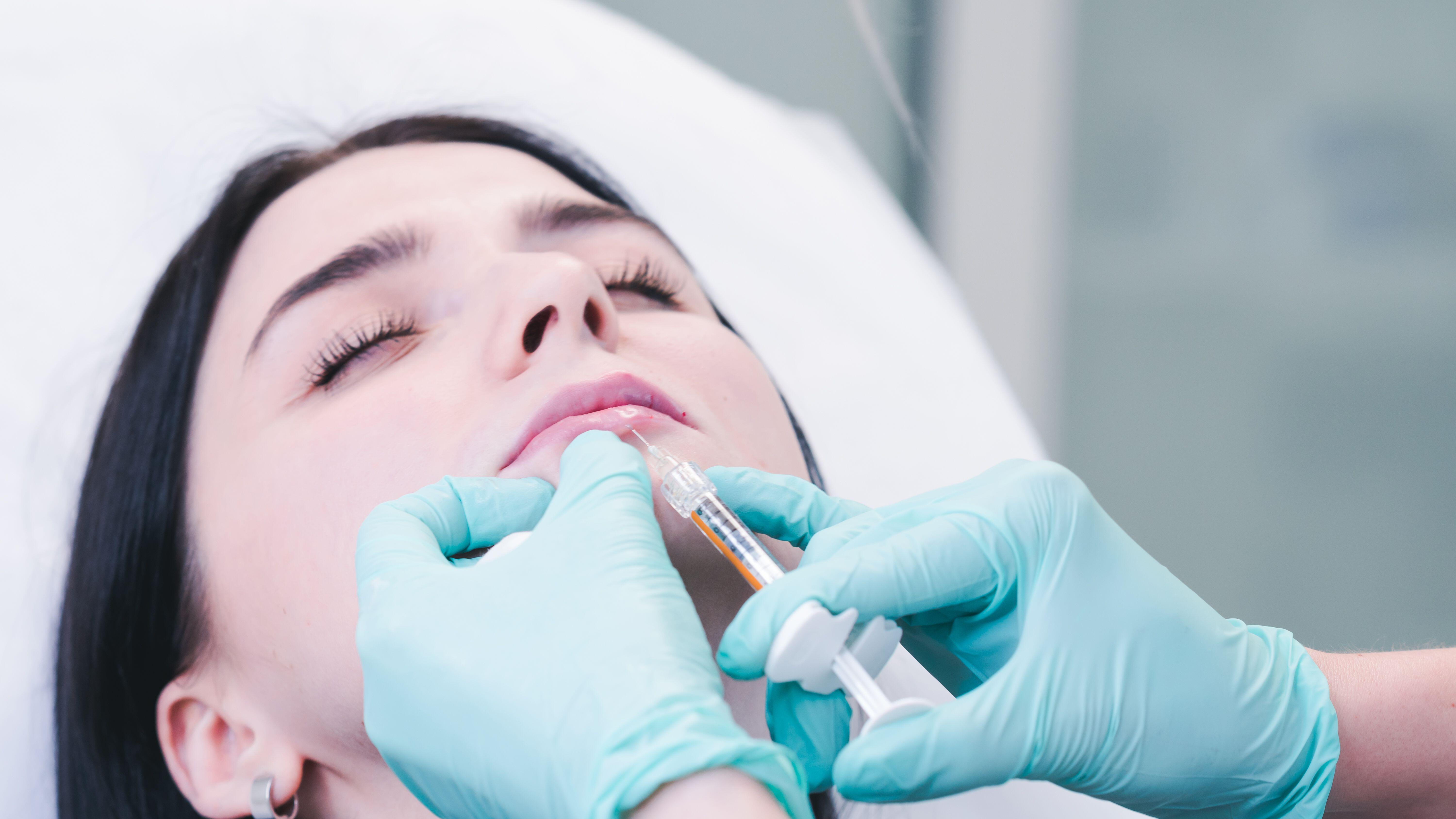 A botox injection in a woman’s lips