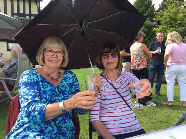 <p>Annie Dawkes and Lynn Grifiths raise a toast in rural Wem </p>