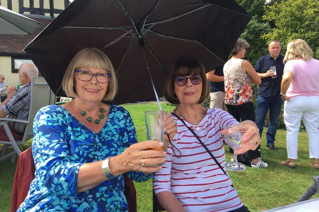 <p>Annie Dawkes and Lynn Grifiths raise a toast in rural Wem </p>