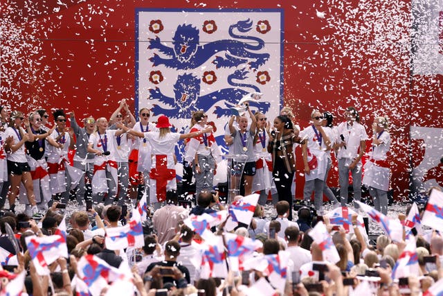 Beth Mead lifts the trophy during a fan celebration to commemorate England’s Euro 2022 triumph in Trafalgar Square (Steven Paston/PA)
