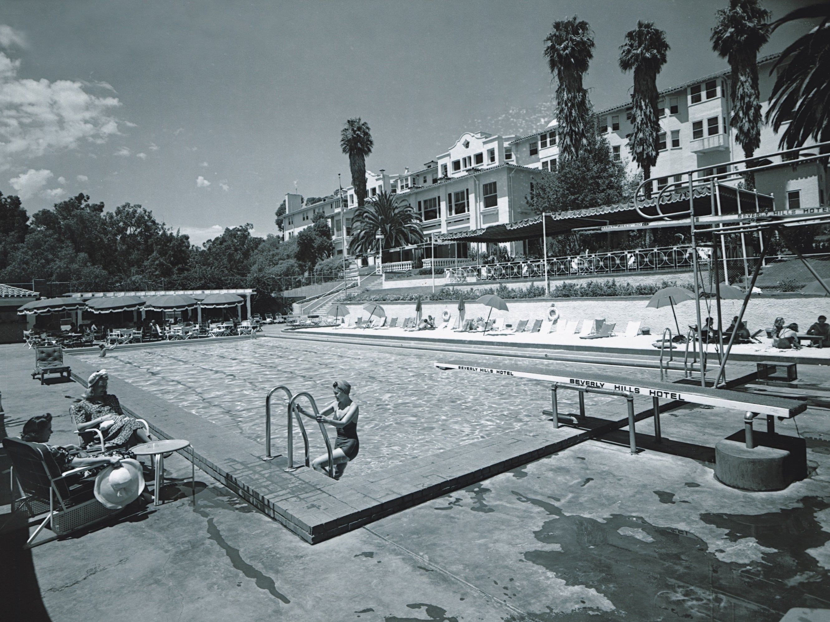 The hotel’s swimming pool, seen here in 1938, was ringed by golden sand shipped in especially from Arizona and has seen its fair share of sensational activity