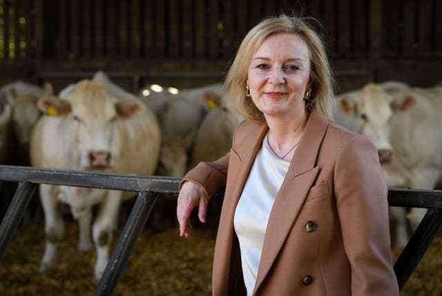 Liz Truss, during her visit to Twelve Oaks Farm in Newton Abbot, Devon (Finnbarr Webster/PA)