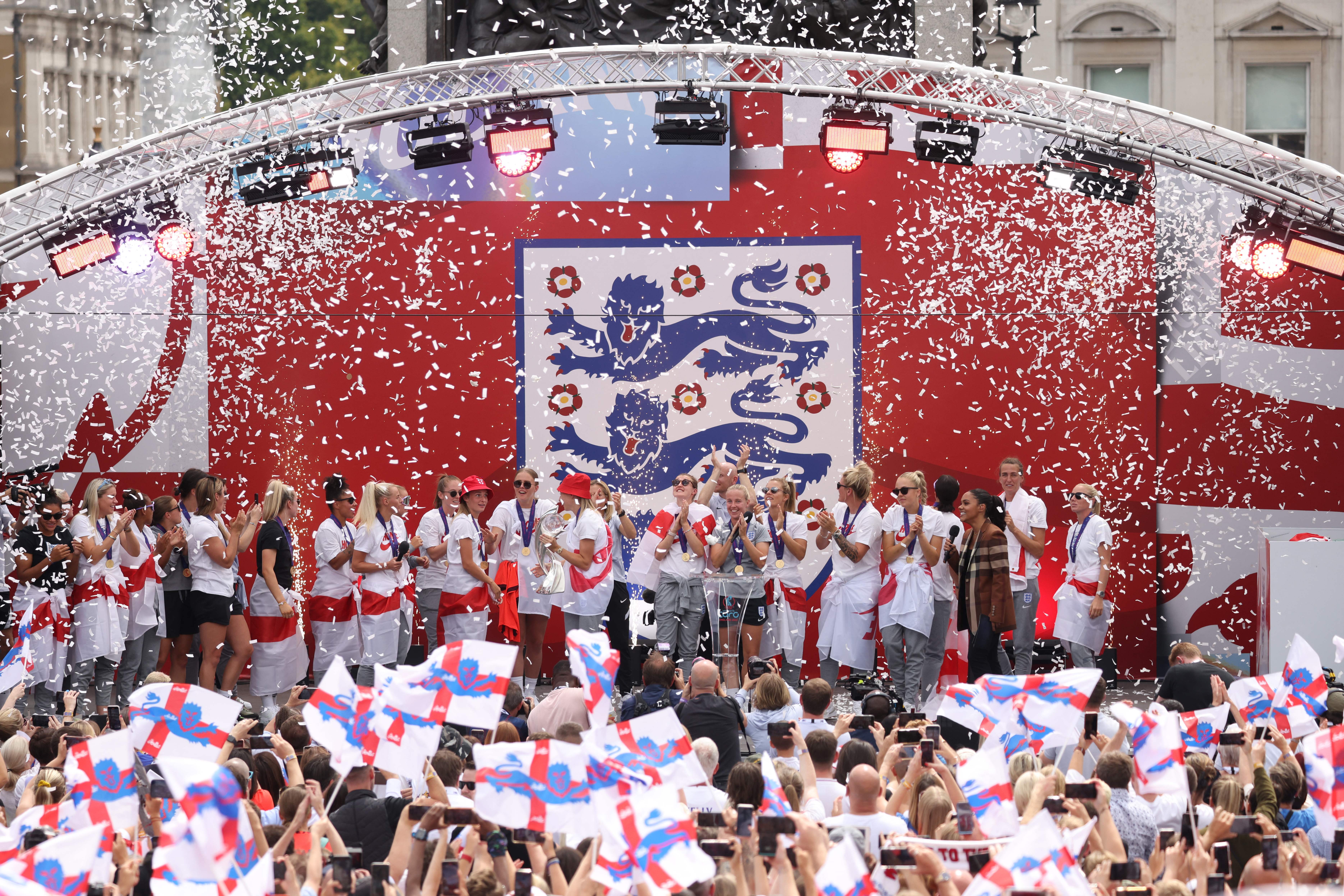 The England Women players celebrate their first trophy, at a victory party in London