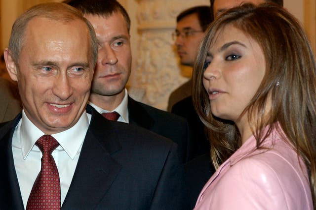 <p>File: Russian president Vladimir Putin, left, speaks with gymnast Alina Kabaeva at a Kremlin banquet in Moscow </p>
