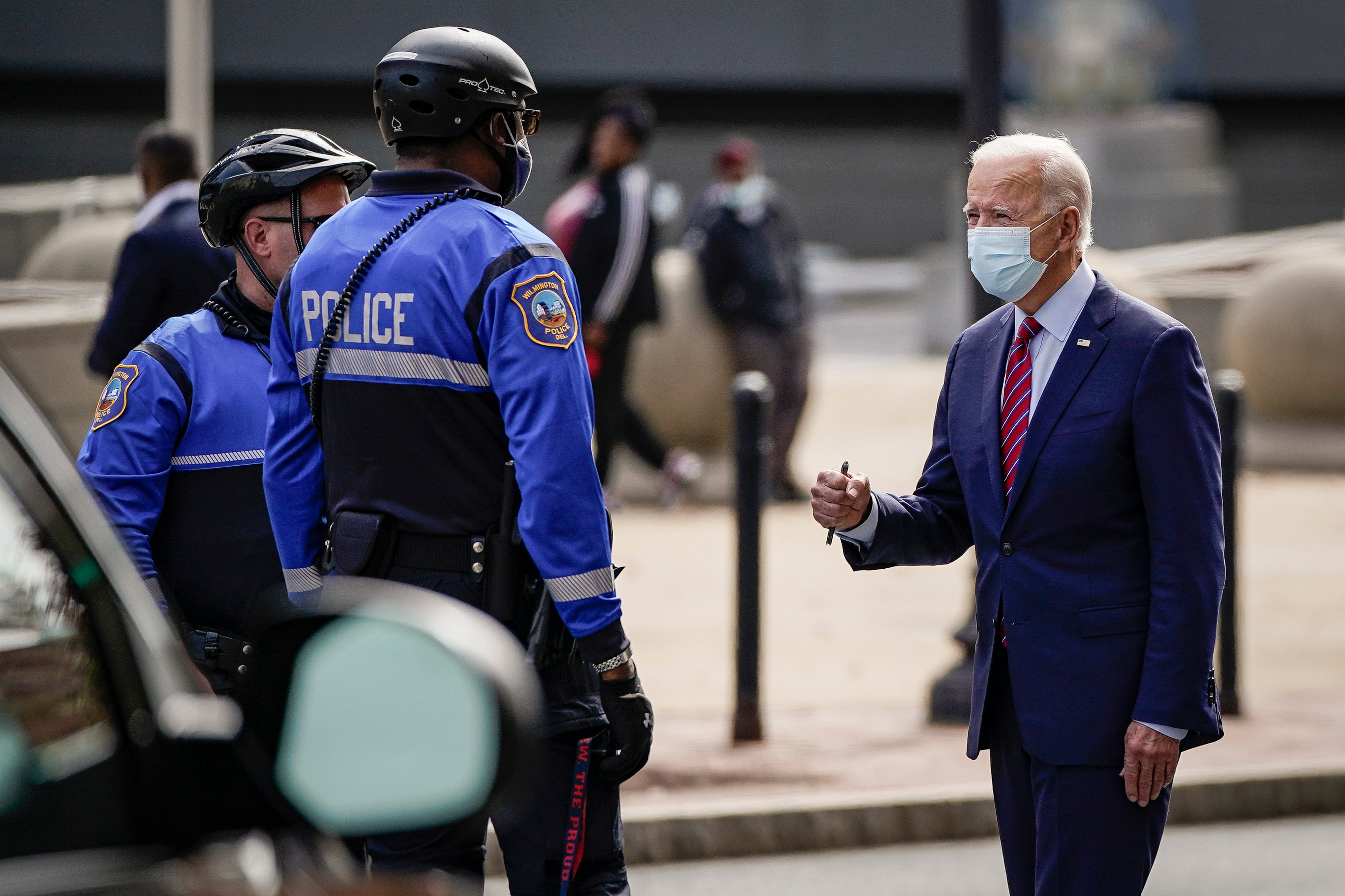 Joe Biden greets police officers as he departs The Queen theater on October 19, 2020 in Wilmington, Delaware