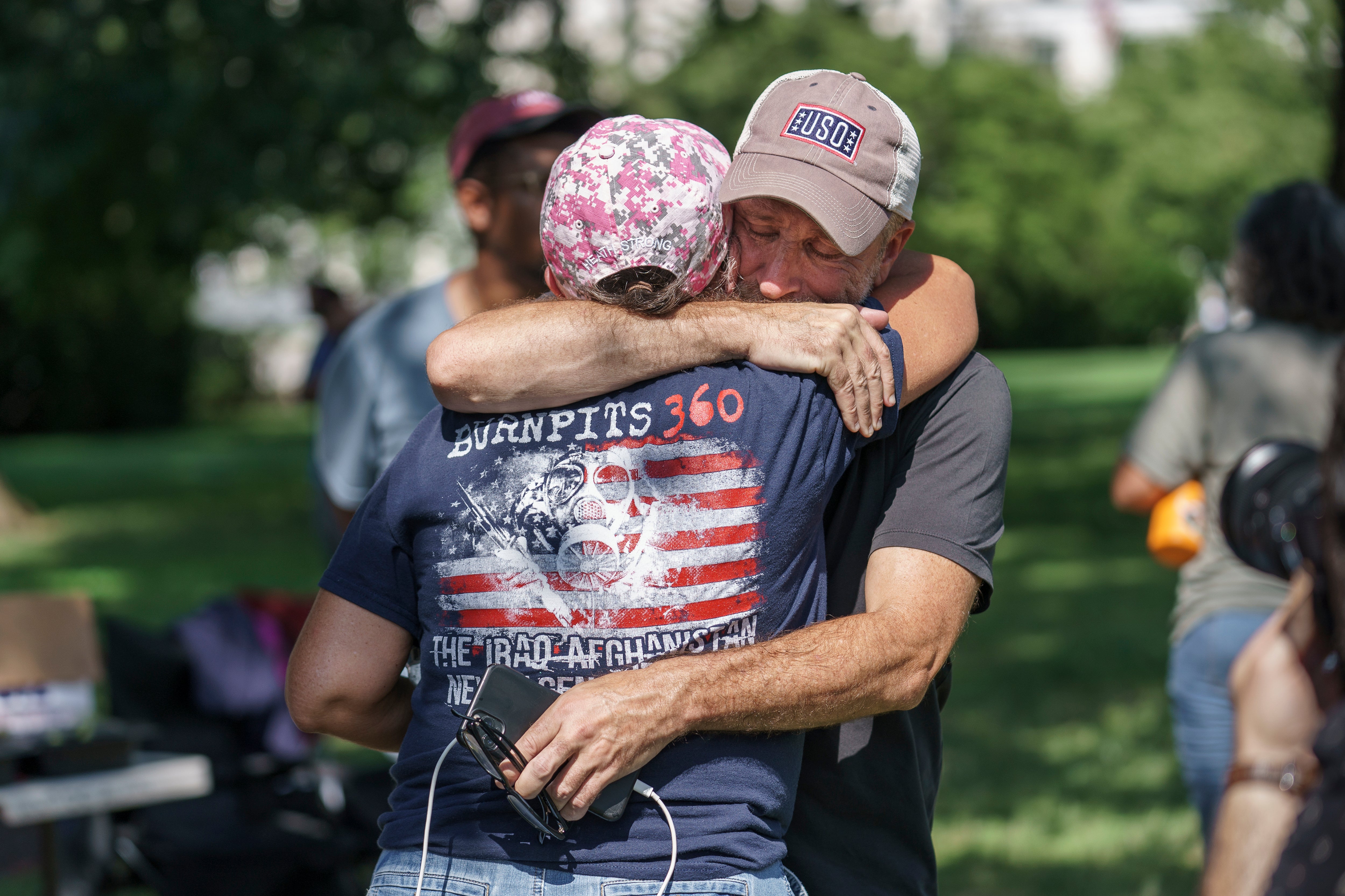 Jon Stewart hugs a veteran campaigner