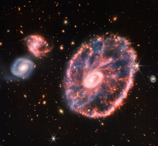 Webb telescope reveals colourful cosmic cartwheel