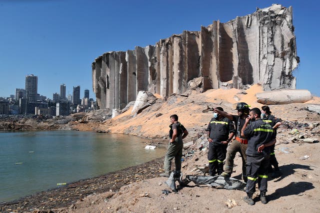 <p>A rescue team surveys the site of a massive explosion in the port of Beirut in 2020</p>