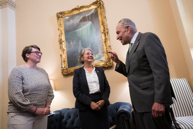 <p>Senate Majority Leader Chuck Schumer, D-N.Y., right, welcomes Paivi Nevala, minister counselor of the Finnish Embassy, left, and Karin Olofsdotter, Sweden's ambassador to the U.S., center, just before the Senate vote to ratify NATO membership for the two nations</p>