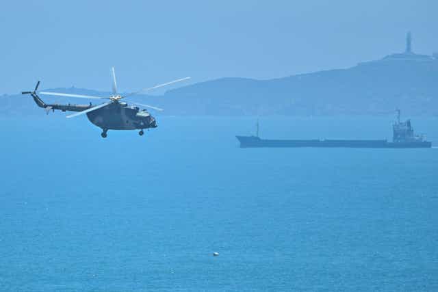 <p>A Chinese military helicopter flies past Pingtan island, one of mainland China’s closest point from Taiwan, in Fujian province on Thursday </p>