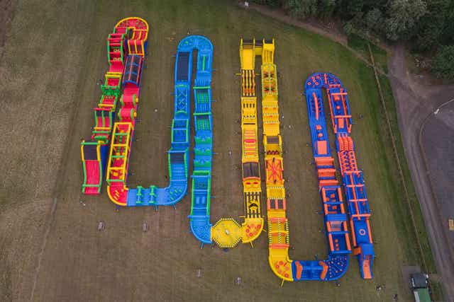 The Tartan Titan, based at Conifox Adventure Park, Edinburgh, is the world’s largest inflatable obstacle course (Conifox/PA)
