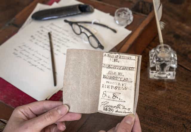 The last Charlotte Bronte miniature manuscript book known to be in private hands, as the book goes on display following its return to the Bronte Parsonage Museum in Haworth, Keighley, West Yorkshire, once the home of the Bronte family (Danny Lawson/PA)