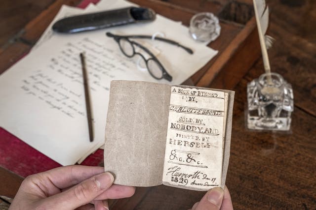 The last Charlotte Bronte miniature manuscript book known to be in private hands, as the book goes on display following its return to the Bronte Parsonage Museum in Haworth, Keighley, West Yorkshire, once the home of the Bronte family (Danny Lawson/PA)