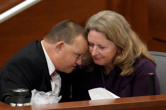 <p>Corey Hixon leans in close to his mother, Debbie Hixon, while giving his victim impact statement during the penalty phase of the trial of Marjory Stoneman Douglas High School shooter Nikolas Cruz </p>