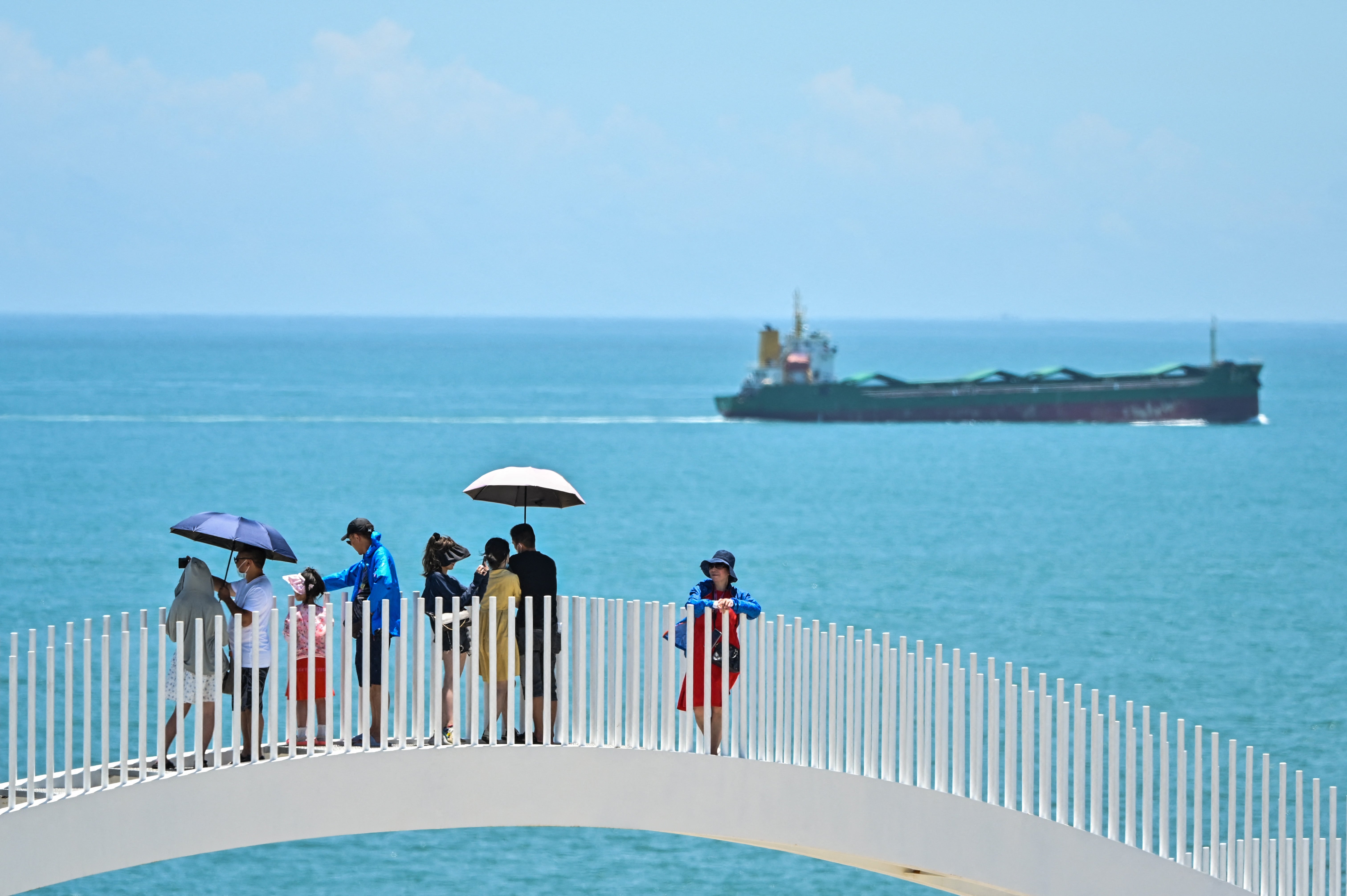 Tourists visit a scenic area on Pingtan island, one of mainland China’s closest point from Taiwan, in Fujian province on 5 August 2022