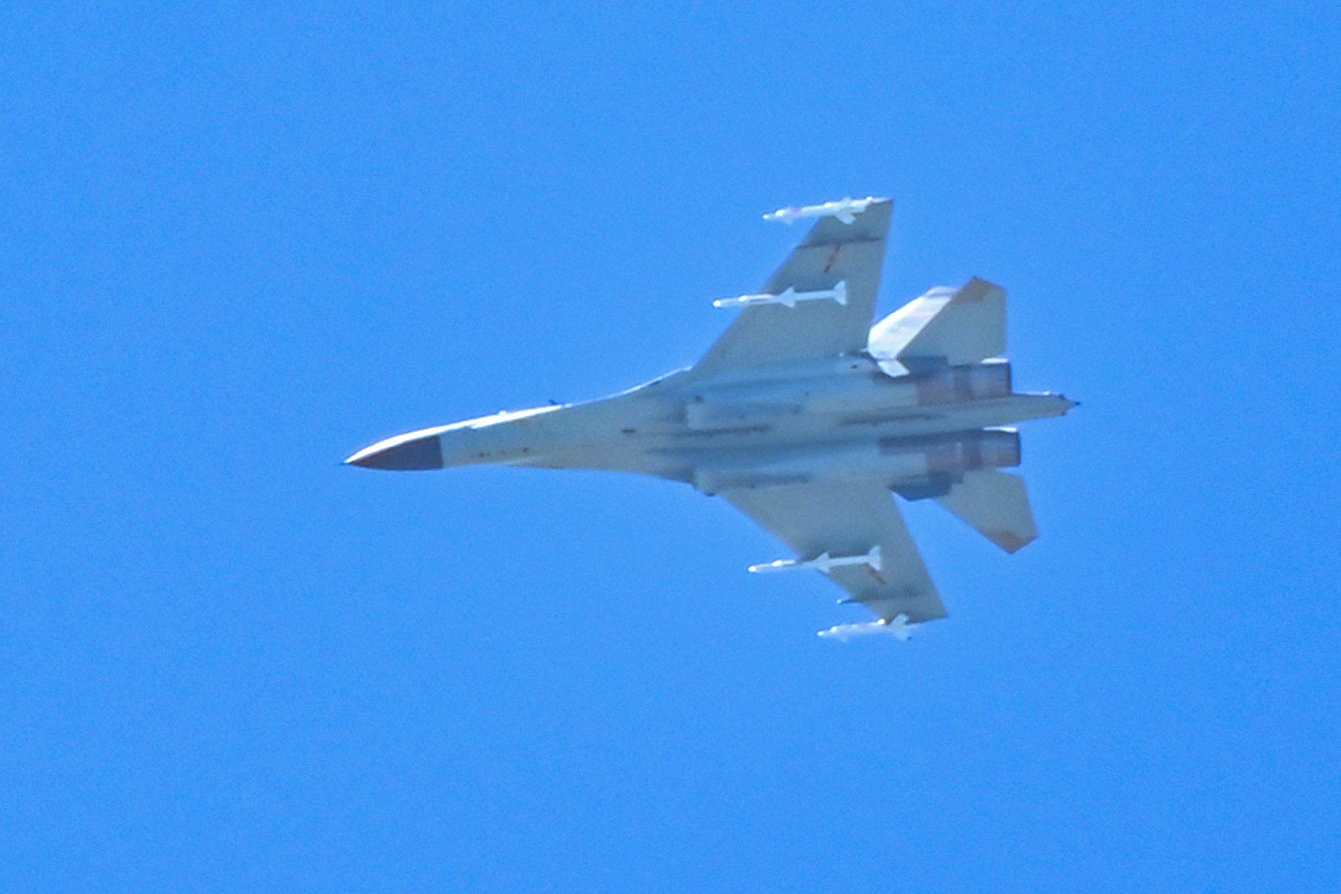 A Chinese military jet flies over Pingtan island, one of mainland China’s closest point from Taiwan, in Fujian province on 5 August 2022