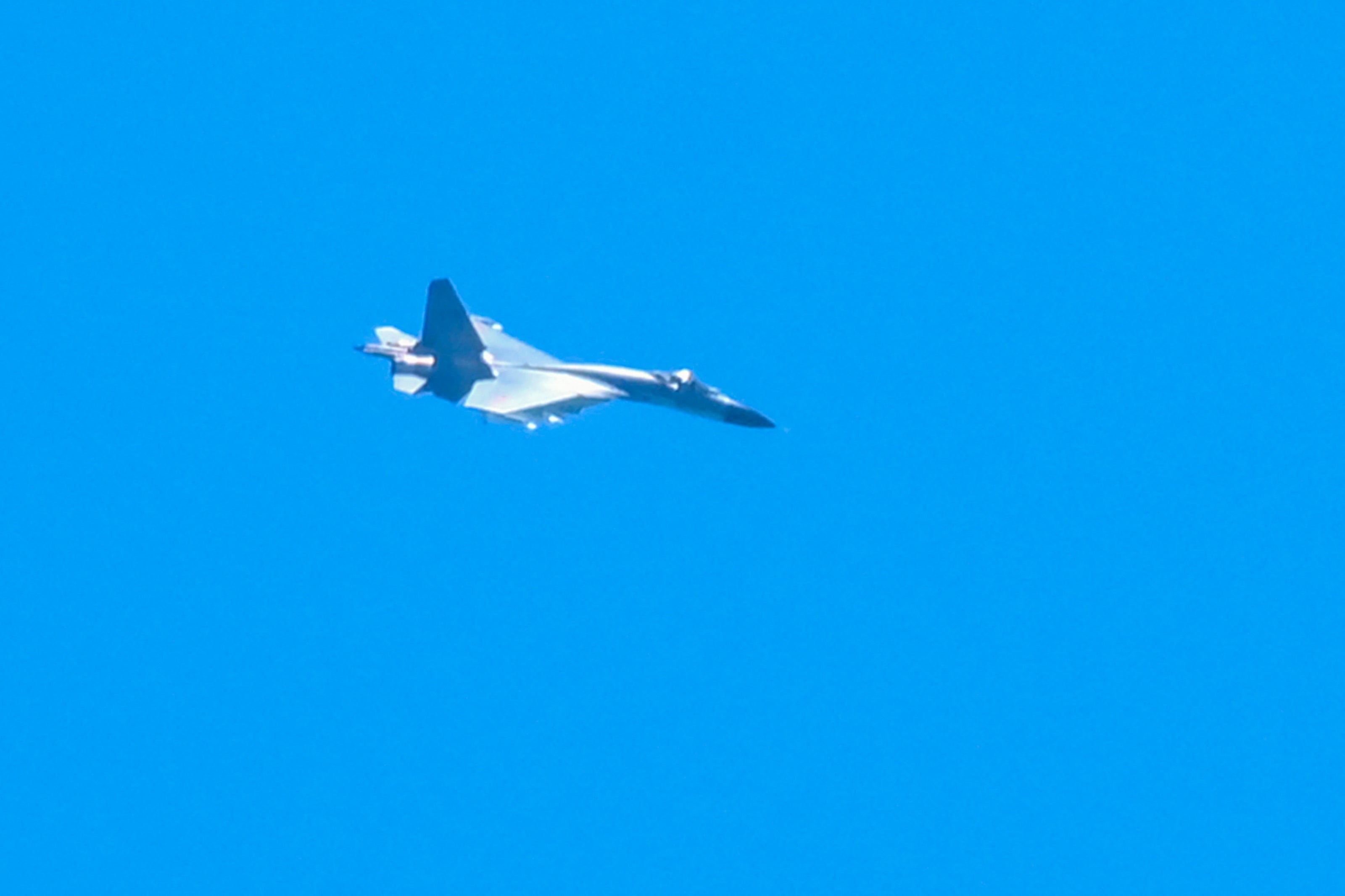 A Chinese military jet flies over Pingtan island, one of mainland China’s closest point from Taiwan, in Fujian province on 5 August 2022