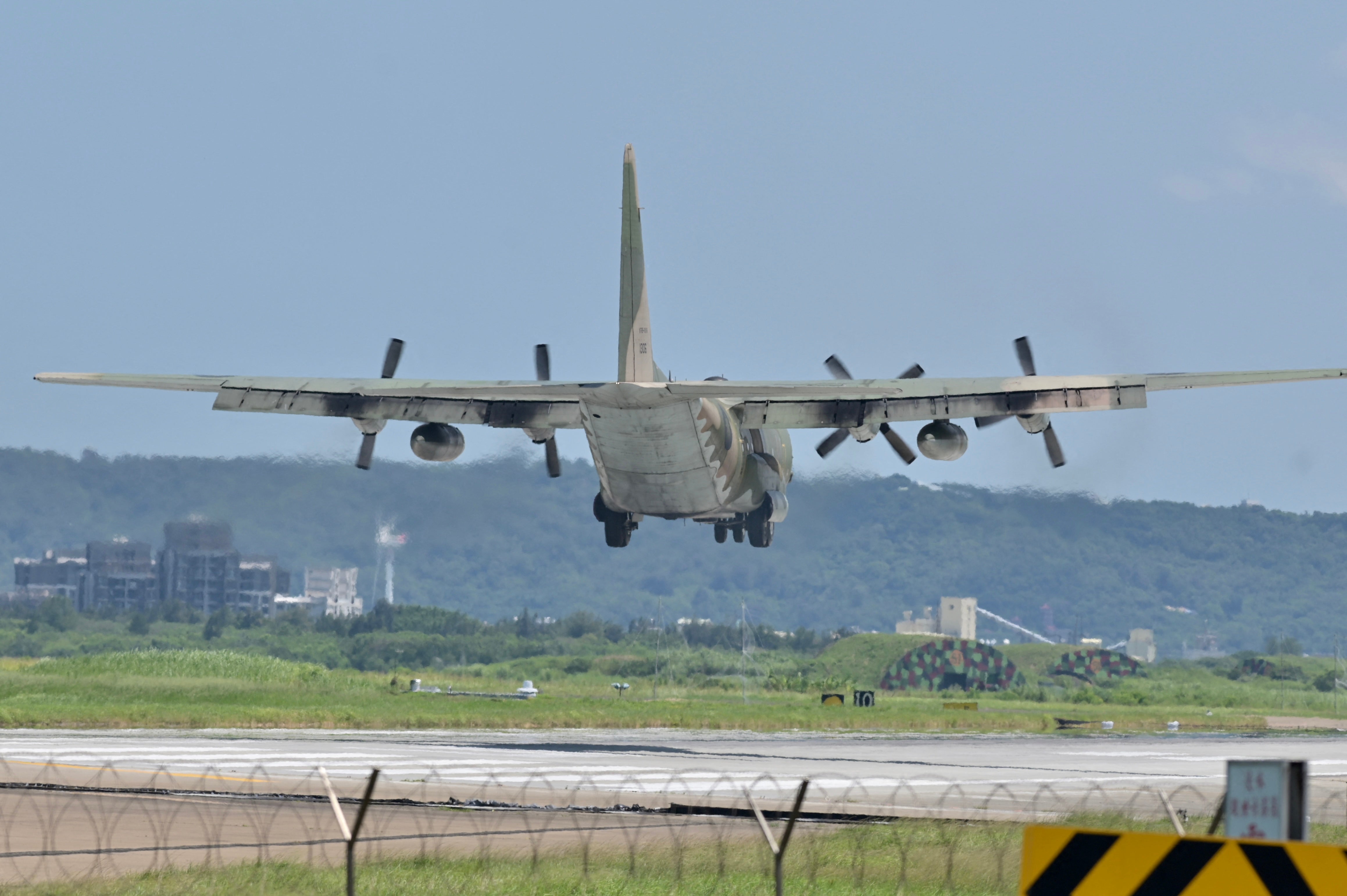 A US-made C-130 aircraft prepares to land on a runway at the Hsinchu Air Base in Hsinchu on 5 August 2022