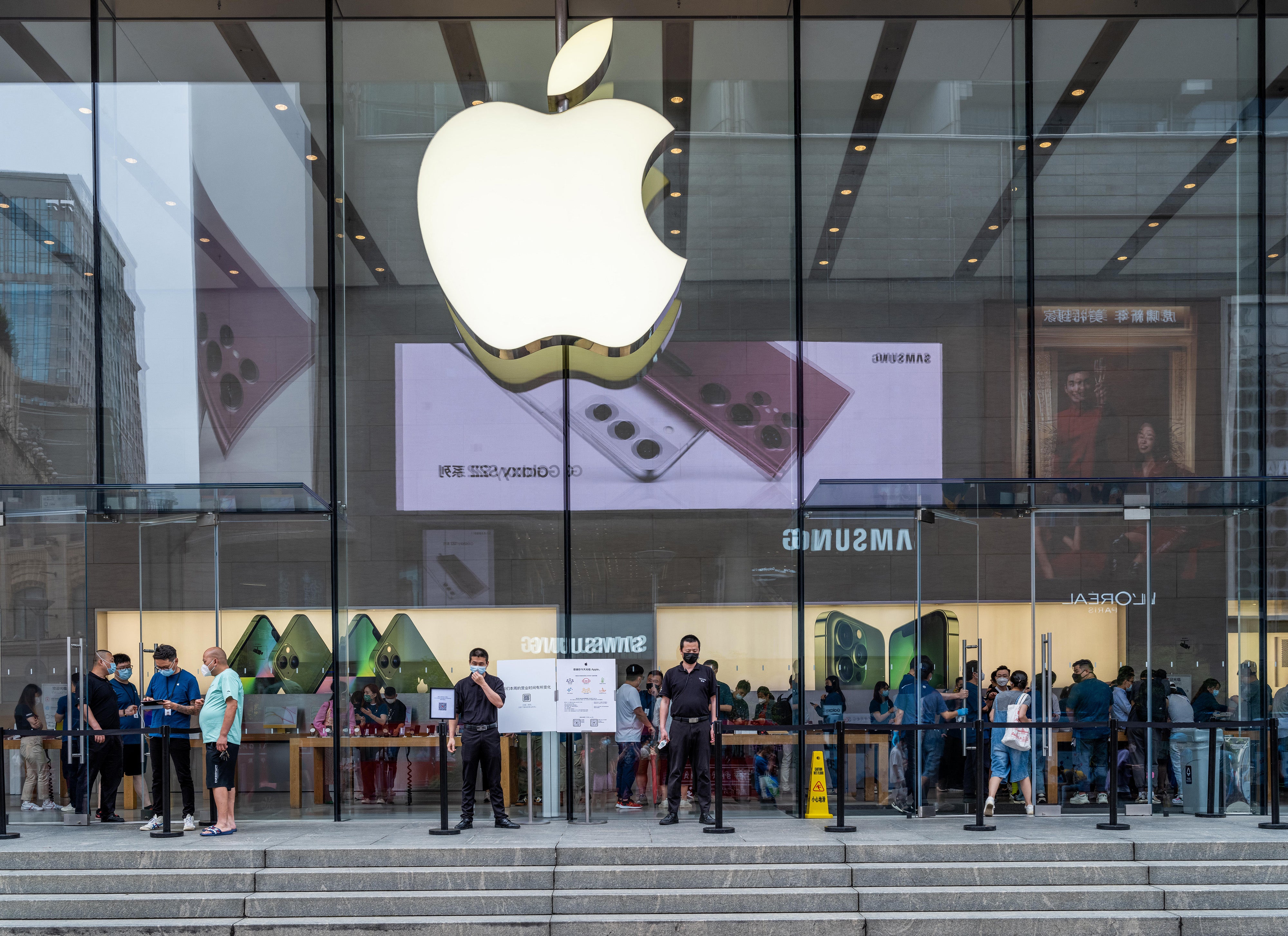 File: People visit an Apple Store in Shanghai on 10 June 2022