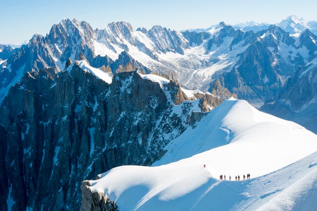 <p>Mont Blanc mountaneers walking on snowy ridge.</p>