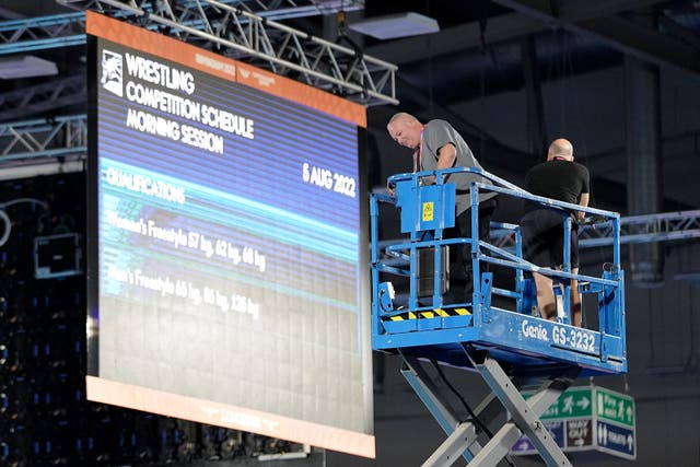 Staff carry out safety checks at the Coventry Arena after a speaker cover fell from the roof at Friday morning’s wrestling session, forcing a delay in the action (Zac Goodwin/PA)