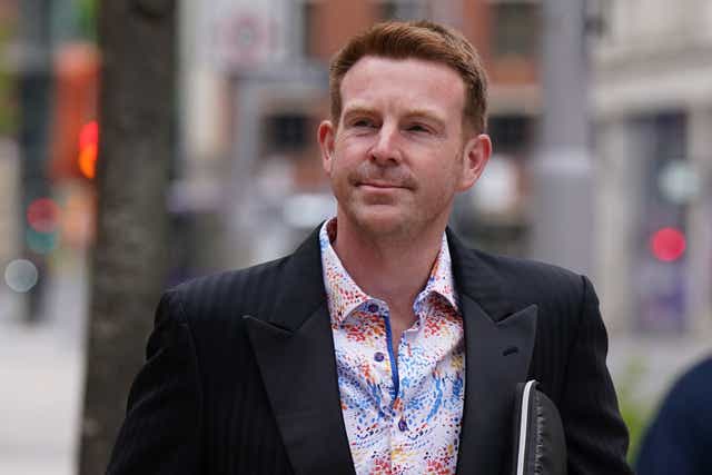 Ex-BBC presenter Alex Belfield arrives at Nottingham Crown Court for trial charged with stalking corporation staff (PA)